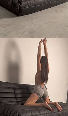 Yoga at Home on the Couch in Bodysuit