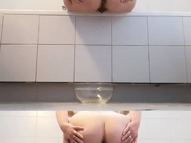 Raven: Peeing in a Glass Bowl While Sitting on the Edge of the Bathtub