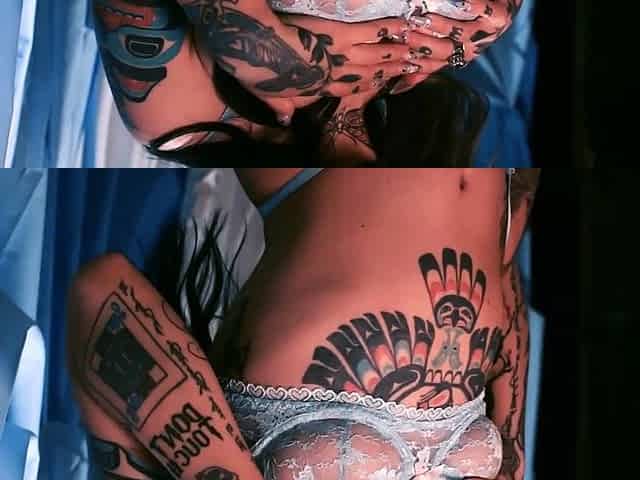 Taylor reveals her tattoo covered body