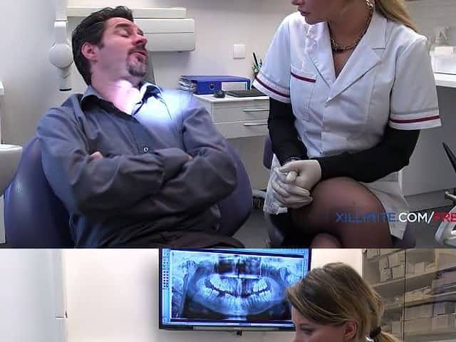 Golden-Haired dentist bangs her patient