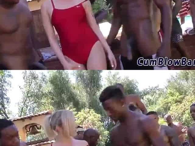 Aroused blonde in a red swimsuit is about to get gangbanged by a group of black guys