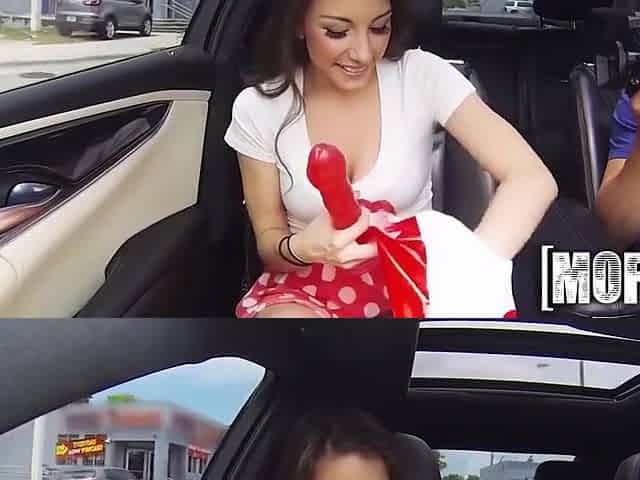 Hot Brunette In A Car With Red Dildo