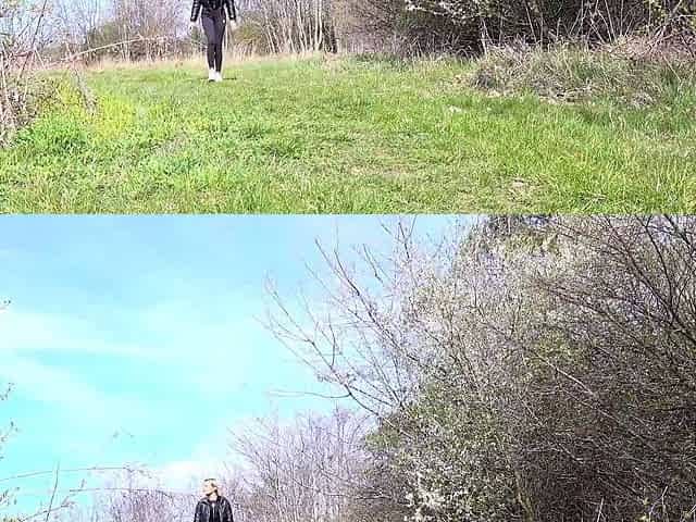 Outdoor solo masturbation scene with curly blonde