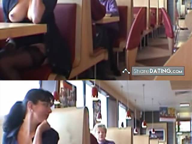 Young brunette flashes her boobs in the restaurant
