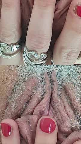 Rubbing stretching pulsing pink vagina in baths close up