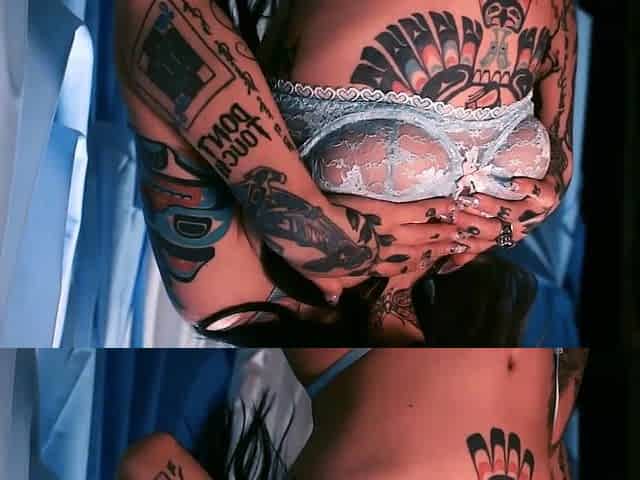 Taylor reveals her tattoo covered body
