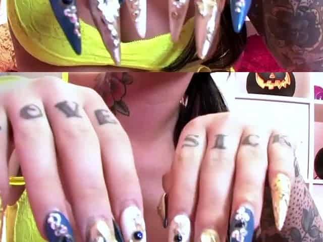 A solo inked brown-haired with massive knockers bends