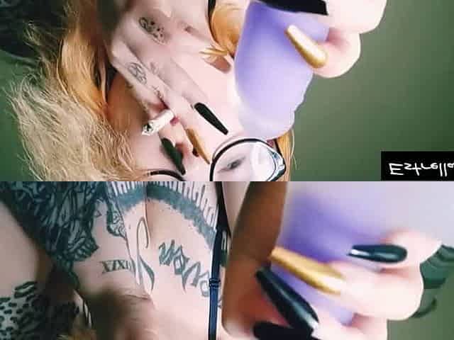 Red haired girl with long nails smoking