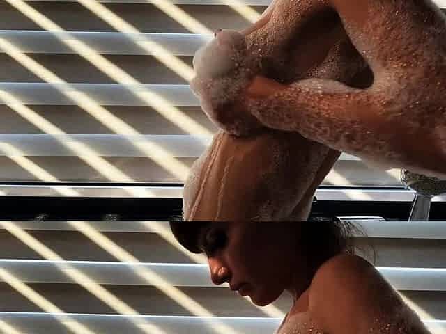 Hot babe with perfect big boobs taking shower