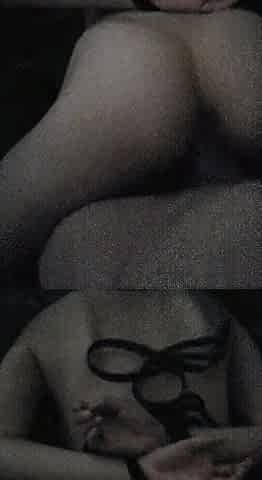 Collar on a gal, hands related behind her back