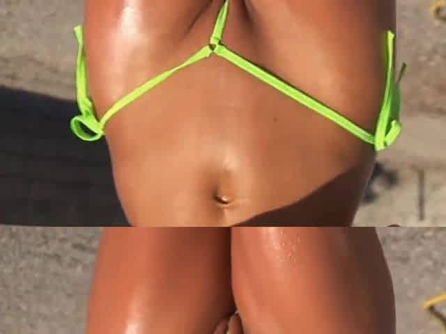 Hot brunette milf in micro bikini posing by pool