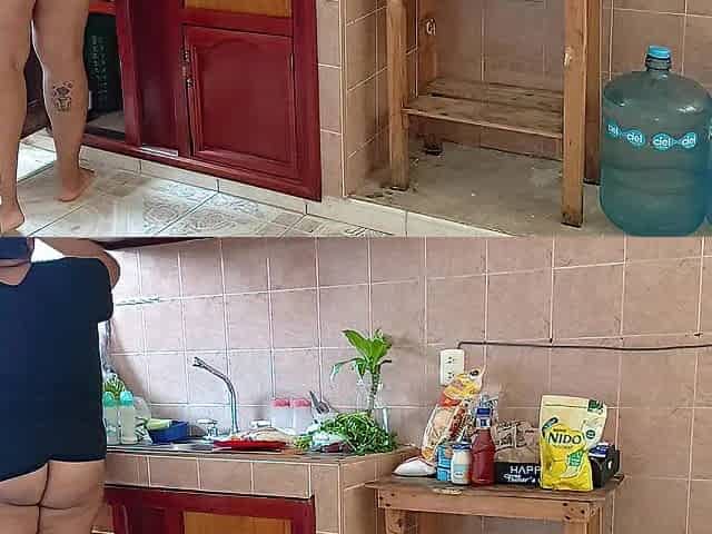 Neighbor Chubby lady in the kitchen of the apartment next door