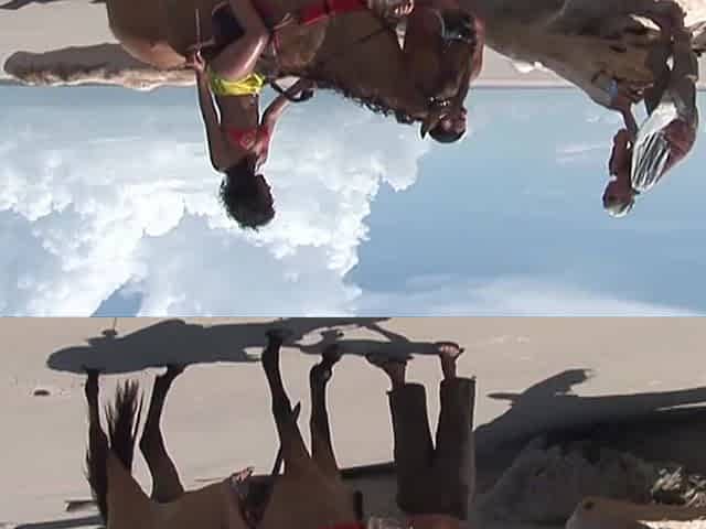 Three-some on beach with ebony mama