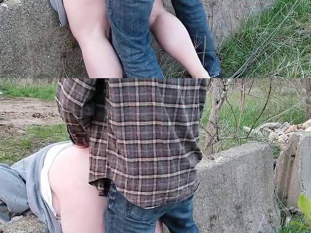 Bent over a concrete barrier