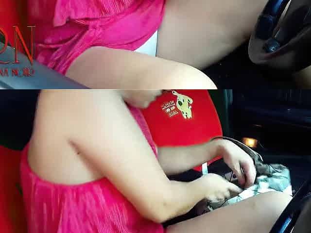 A lady masturbates in a car in a parking lot Teasing a love button with a sex tool