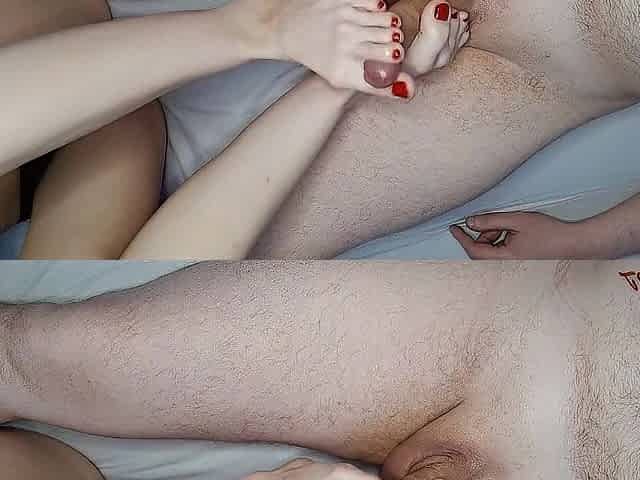Cute gal does footjob with her pretty feet with red toenails