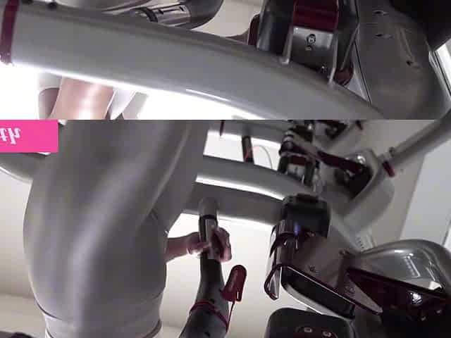 Athletic milf with big tits exposes her rack while working out in gym