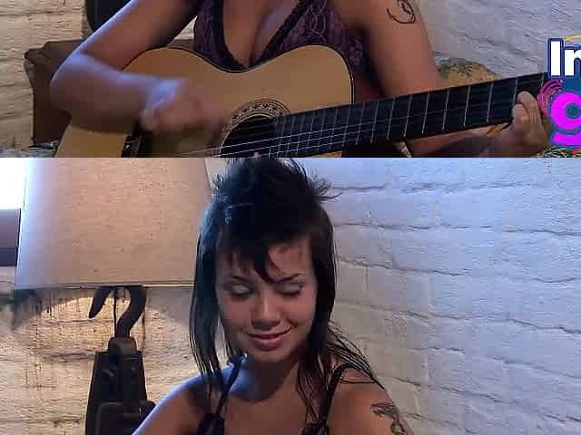 Hot Paul showing her medium tits and pussy with guitar