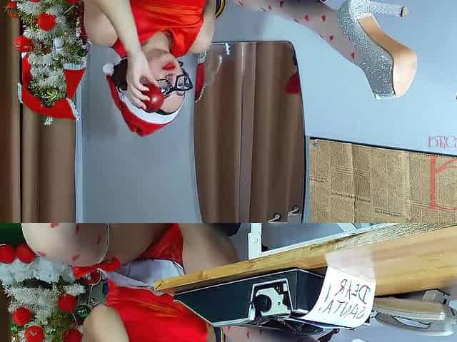 Nice-looking lady secretary clothed as a gnome, Santa's assistant on Christmas eve. FULL