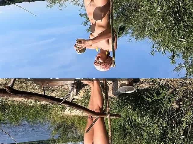 Blonde Solo Girl Cooks Naked by the Campfire