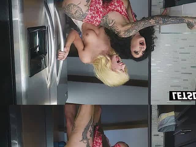 Tattooed Curvy Lesbo Gets Pounded Doggy With a Thong-On Against the Fridge