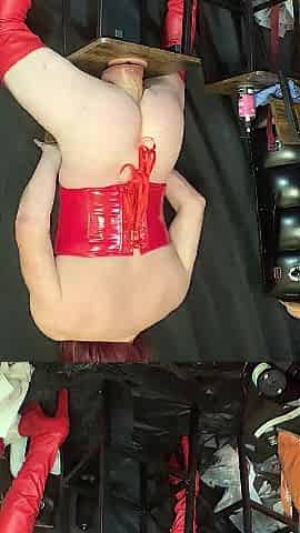 Red corset and haunch-high boots and biggest
