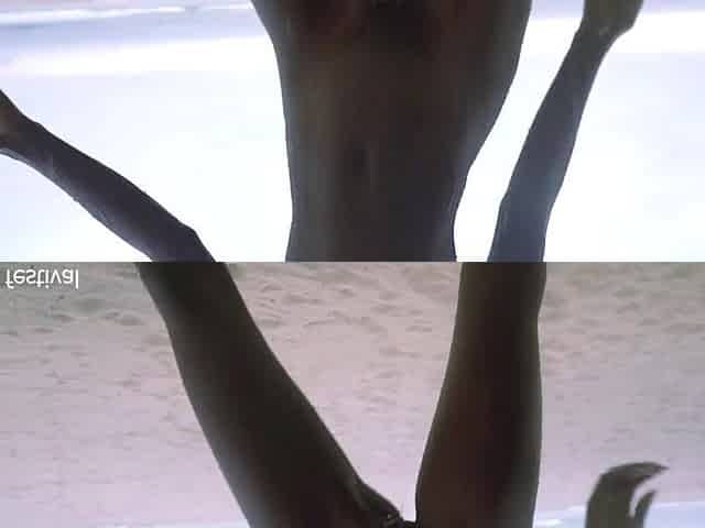 Slender black village beauty dancing undressed in the rain with her ideal slender body