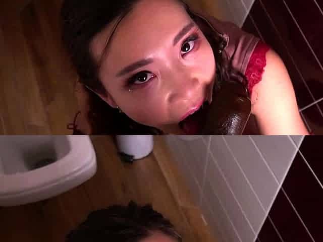 Asian bimbo sucks on a big cock close up