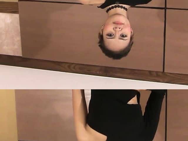 Asian beauty takes her dress off in a very seductive routine