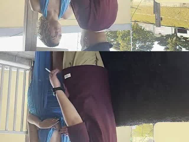 Strangers making out on a balcony during the party.