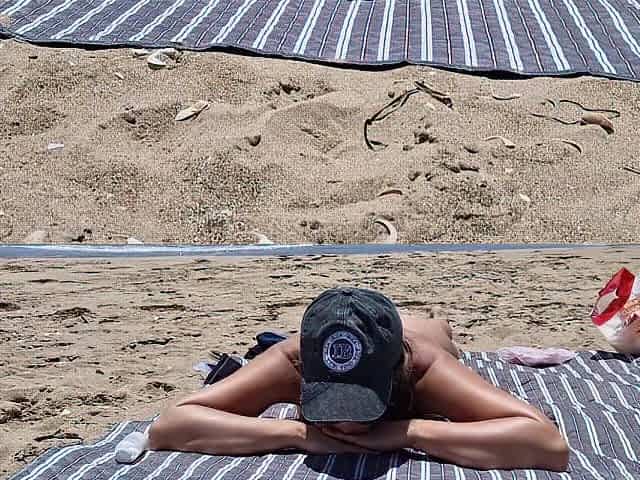 youthful woman gets screwed on the beach by a stranger screwing from behind