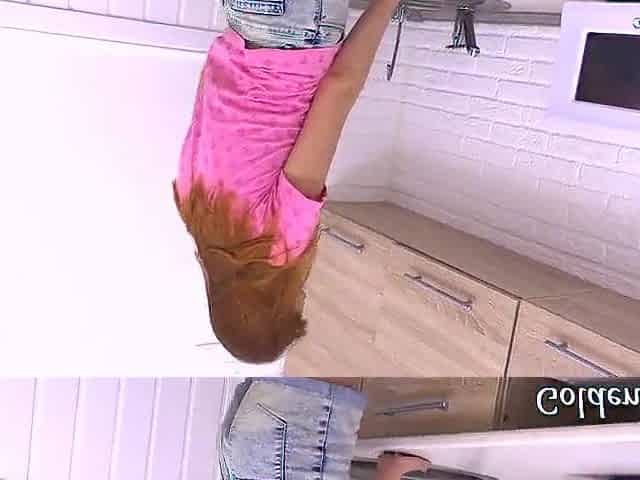 Redhead hotty masturbates her cunt in the kitchen