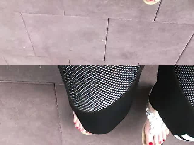 Sandals teasing outdoor with red toenails & toes wiggling