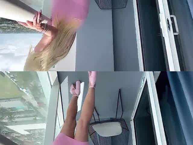 Sexy mother I'd like to fuck undresses without her pink suit and plays with her twat on balcony