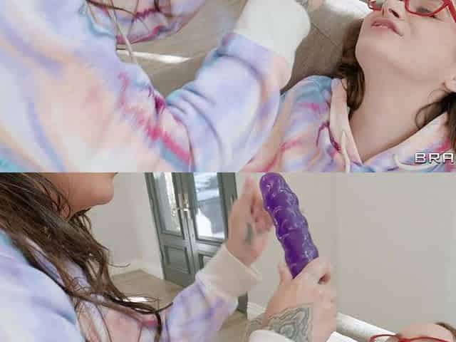 Hazel Moore and Suttin in glasses share the dildo