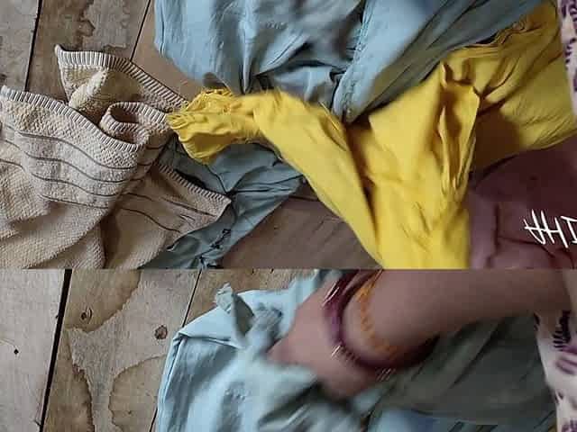 Indian Girl Folding Clothes in Her Bedroom