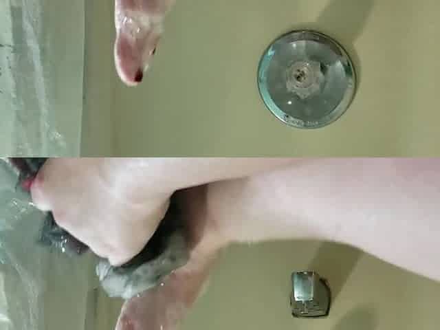 Washing my charming little feet in the bathtub.