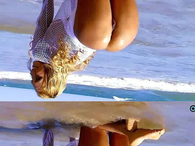 That guy's taking outdoor beach photography of his muse who shines like a blond sun