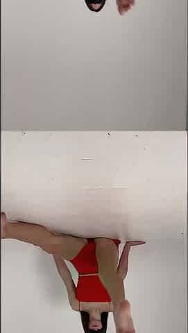 stretching -lengthy legs -red short petticoat