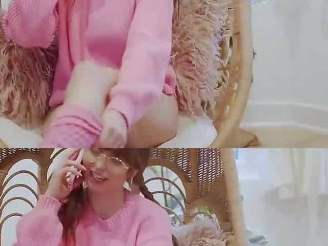 Brunette female in pink sweater likes a phone kink