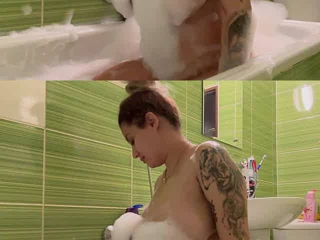 Pregnant beauty captivates with sultry, massive bath allure