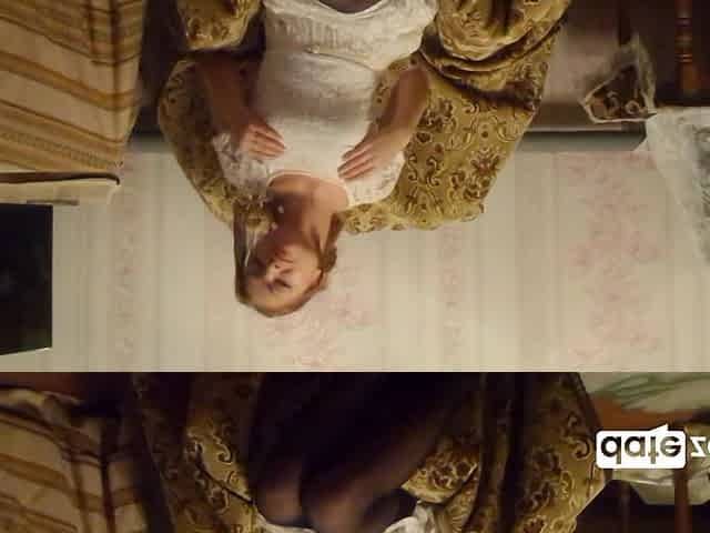 Young Amateur in Shiny Stockings Pulls up Her Dress and Masturbates on a Chair