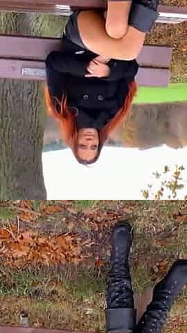 Hot red colored girl stays and enjoys outdoor masturbation