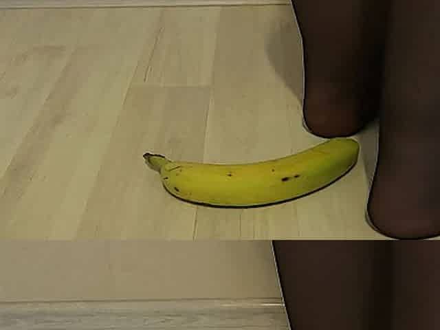 lady in nylon hose feet crushes a banana
