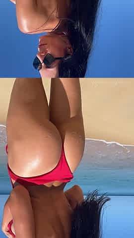 Teasing in Red Bikini on the Beach