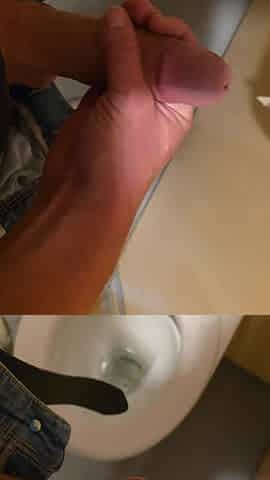Wank in a public latrine building
