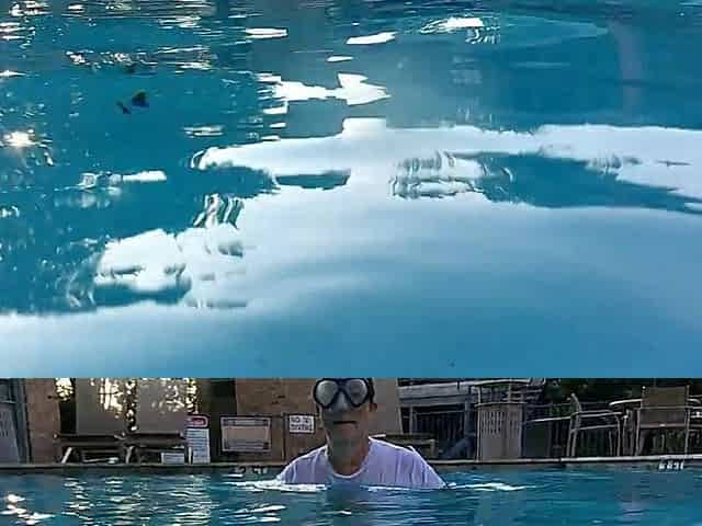 Couple Underwater Diving and Swimming