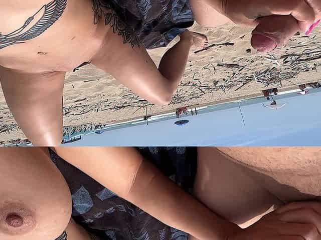 Nudist pair fingering on public beach