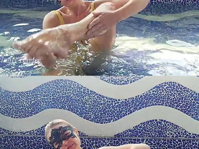 Tiny playgirl playing in the swimming pool with her breasts, booties, cunt and feet.