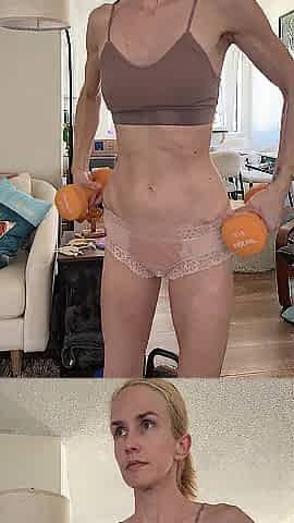 Fit slim golden-haired arm workout in pants
